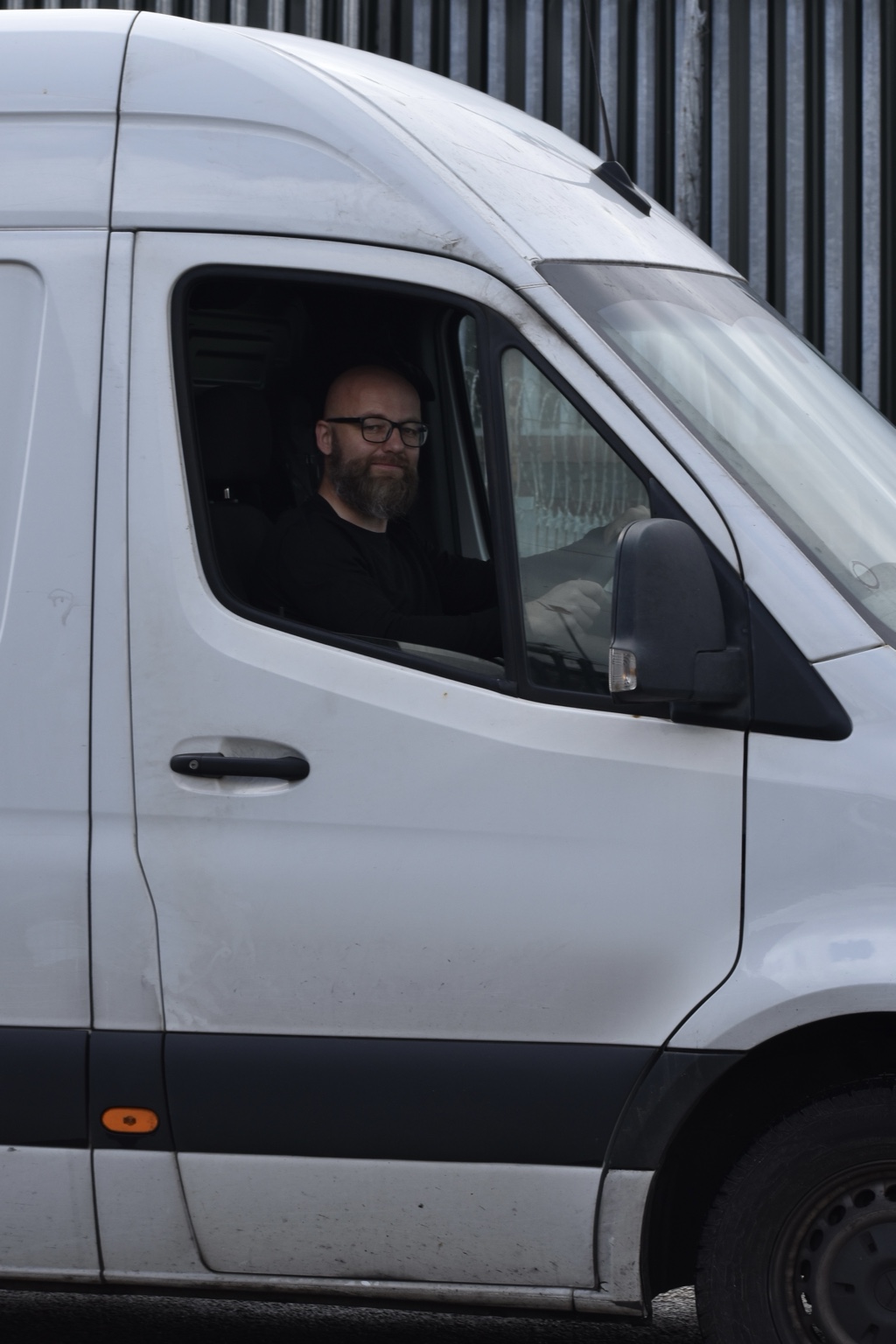 Greg in the driver’s seat of the motorcycle transport van
